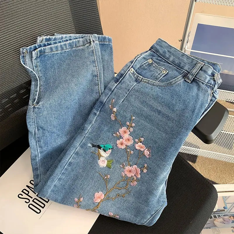 New Chinese high-waisted embroidered jeans women's spring and autumn new fashion loose slim design sense niche split pants.
