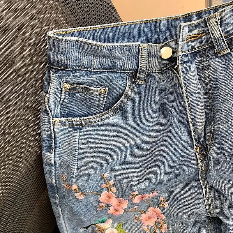 New Chinese high-waisted embroidered jeans women's spring and autumn new fashion loose slim design sense niche split pants.