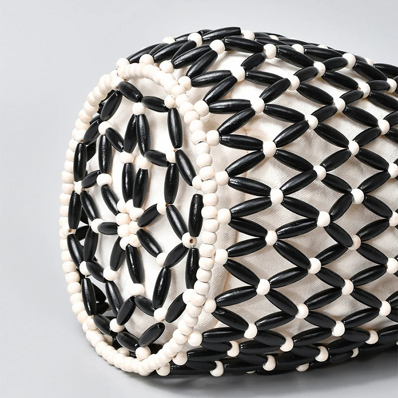 Hollow wood bead straw bag lady fashion brand texture drawstring design shoulder bag simple versatile cylindrical crossbody bag