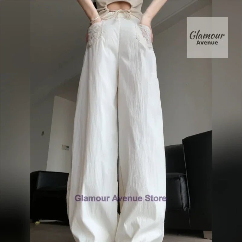 French retro lace design stitching pants women's summer new fashion temperament straight loose wide leg drop casual pants.