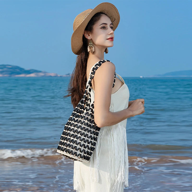 Hollow wood bead straw bag lady fashion brand texture drawstring design shoulder bag simple versatile cylindrical crossbody bag