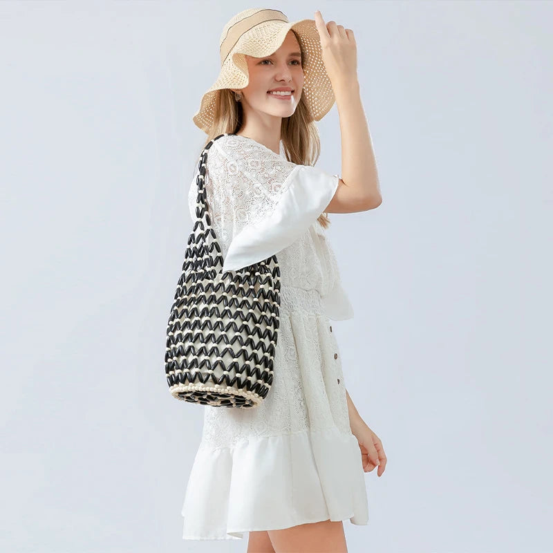 Hollow wood bead straw bag lady fashion brand texture drawstring design shoulder bag simple versatile cylindrical crossbody bag