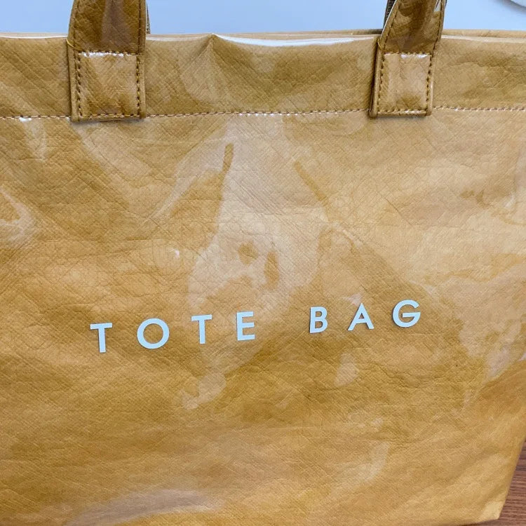 Kraft paper jelly waterproof bag, women's new retro commuting large capacity DuPont paper tote bag