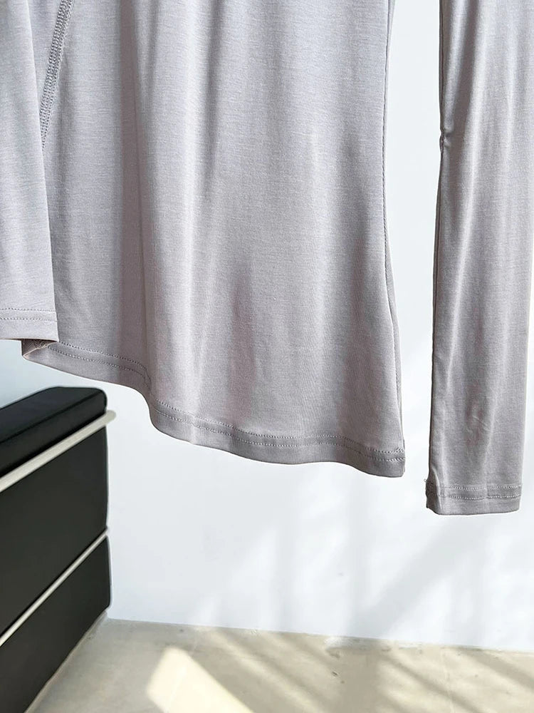 [EAM] Women Gray Thin Perspective Slim Irregular T-shirt New Round Neck Long Sleeve Fashion Tide Spring Autumn 2025 1DH9981