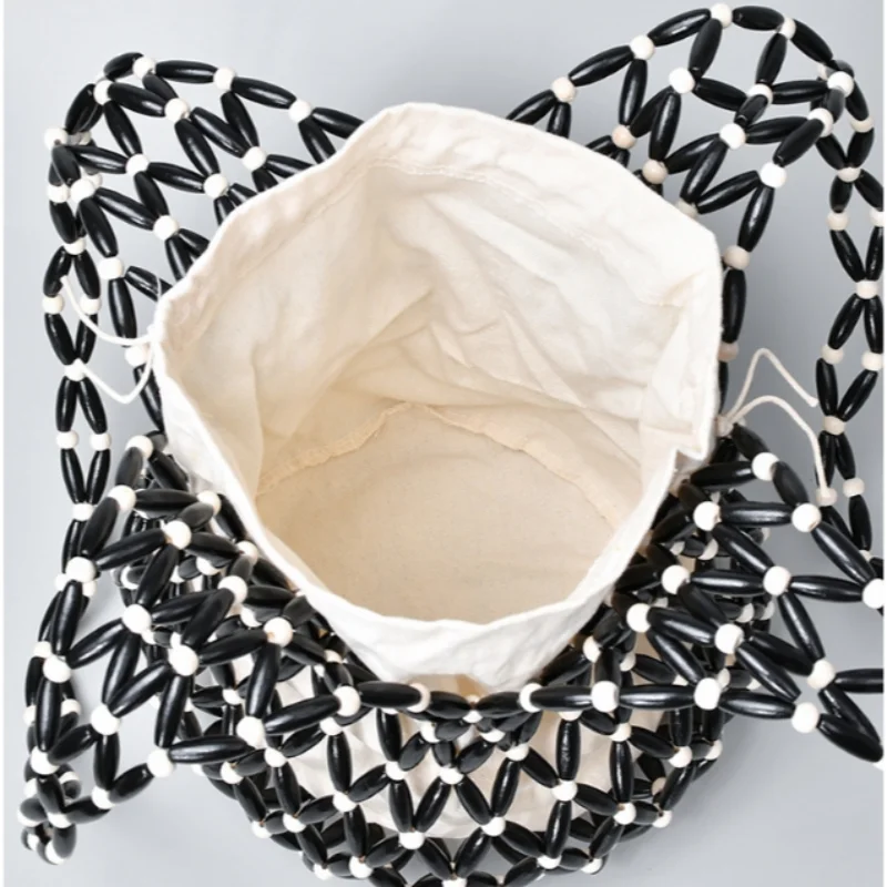 Hollow wood bead straw bag lady fashion brand texture drawstring design shoulder bag simple versatile cylindrical crossbody bag