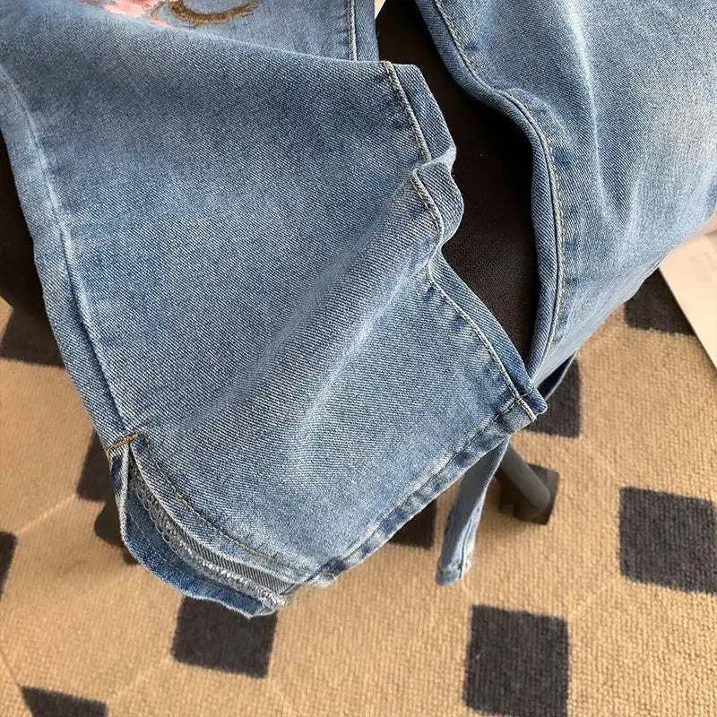New Chinese high-waisted embroidered jeans women's spring and autumn new fashion loose slim design sense niche split pants.