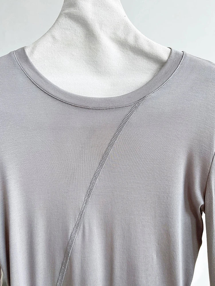[EAM] Women Gray Thin Perspective Slim Irregular T-shirt New Round Neck Long Sleeve Fashion Tide Spring Autumn 2025 1DH9981