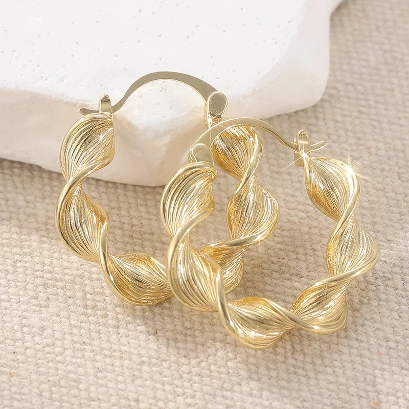 Carved Twisted Gold Tone Hoop Earrings