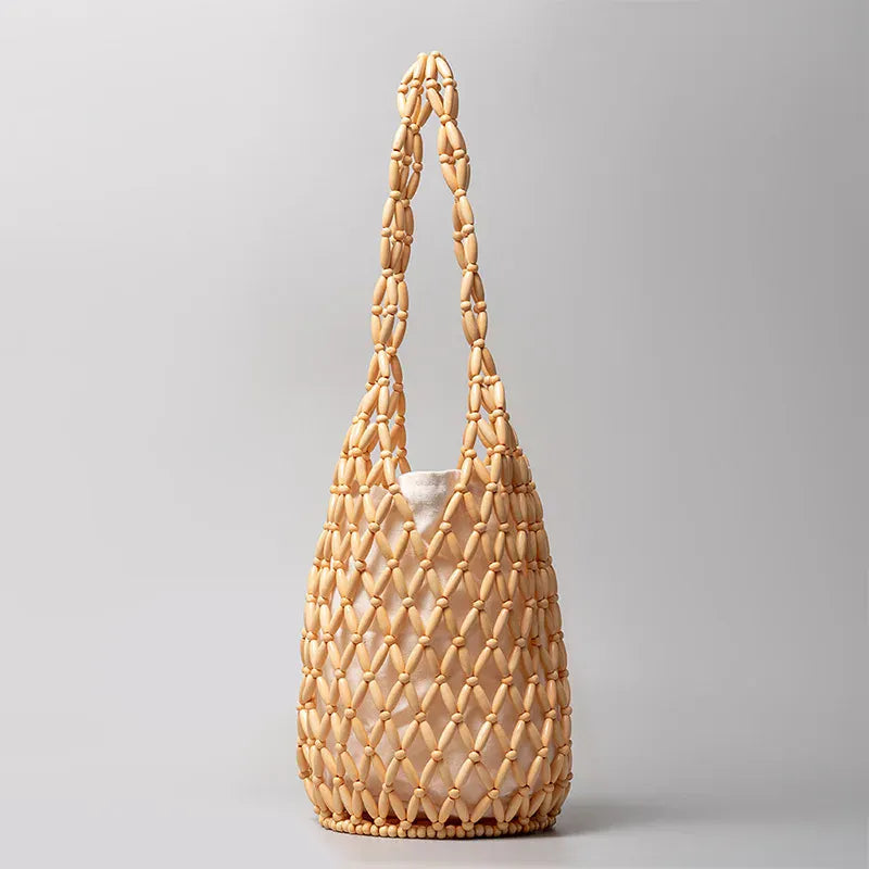 beige Hollow wood bead straw bag lady fashion brand texture drawstring design shoulder bag simple versatile cylindrical crossbody bag