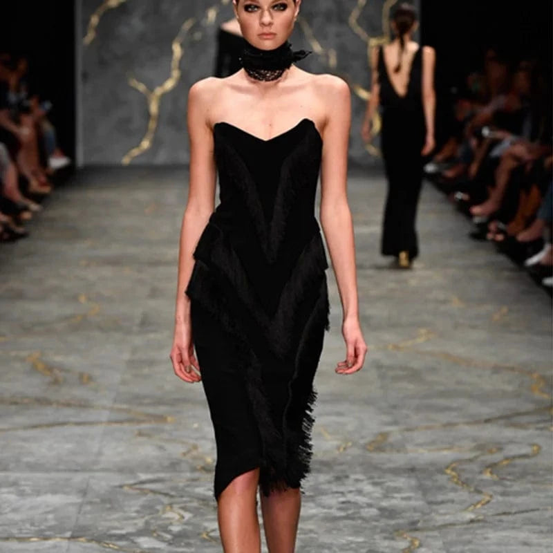 Female confident and generous black low-cut evening dress