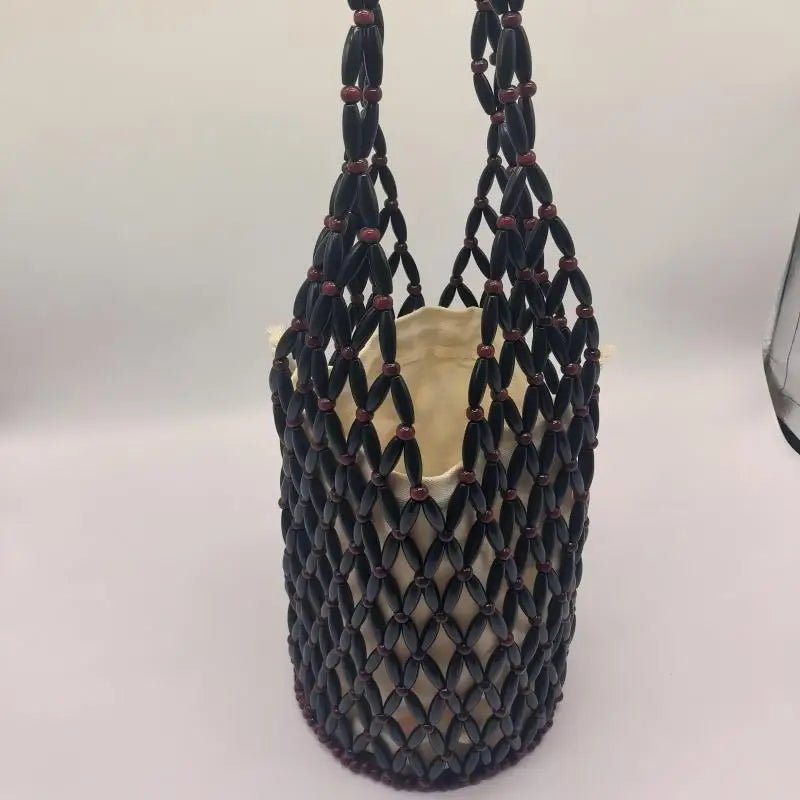 Hollow wood bead straw bag lady fashion brand texture drawstring design shoulder bag simple versatile cylindrical crossbody bag - SN Wigs & More