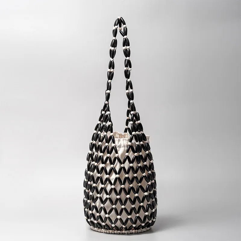 Hollow wood bead straw bag lady fashion brand texture drawstring design shoulder bag simple versatile cylindrical crossbody bag - SN Wigs & More