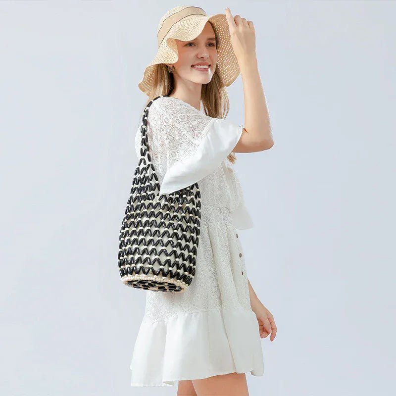Hollow wood bead straw bag lady fashion brand texture drawstring design shoulder bag simple versatile cylindrical crossbody bag - SN Wigs & More