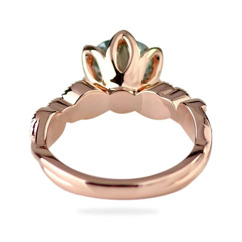 Stylish eternity 10k rose gold engagement ring with 1.5cts light blue round cut moissanite diamond