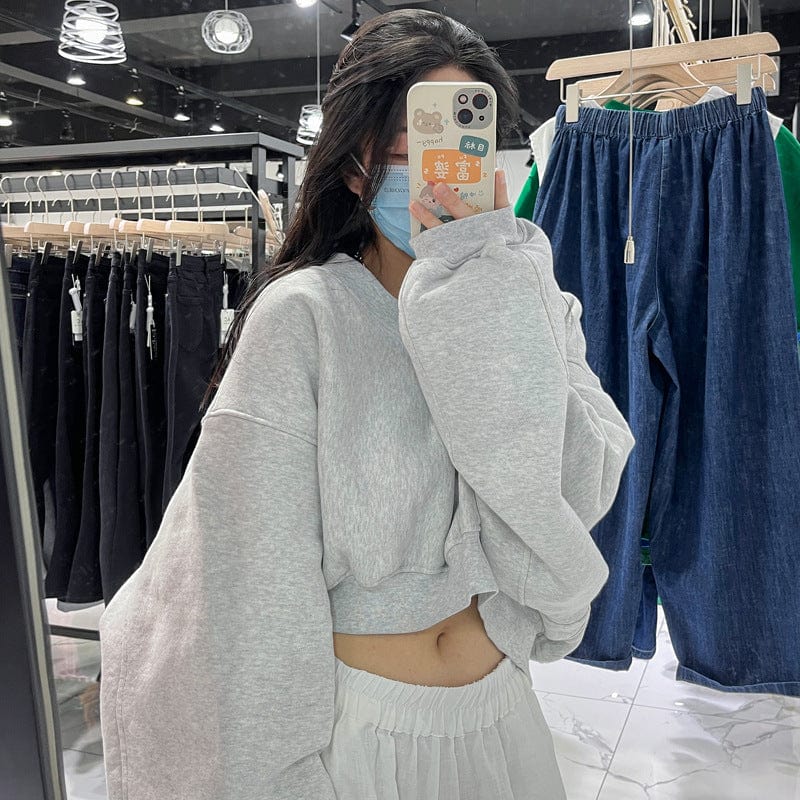 Black sweater women's thin loose loose 2023 spring and autumn all-match high-waisted navel-exposed short long-sleeved top