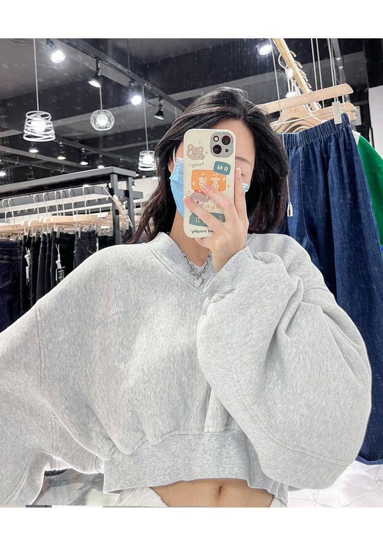 Black sweater women's thin loose loose 2023 spring and autumn all-match high-waisted navel-exposed short long-sleeved top