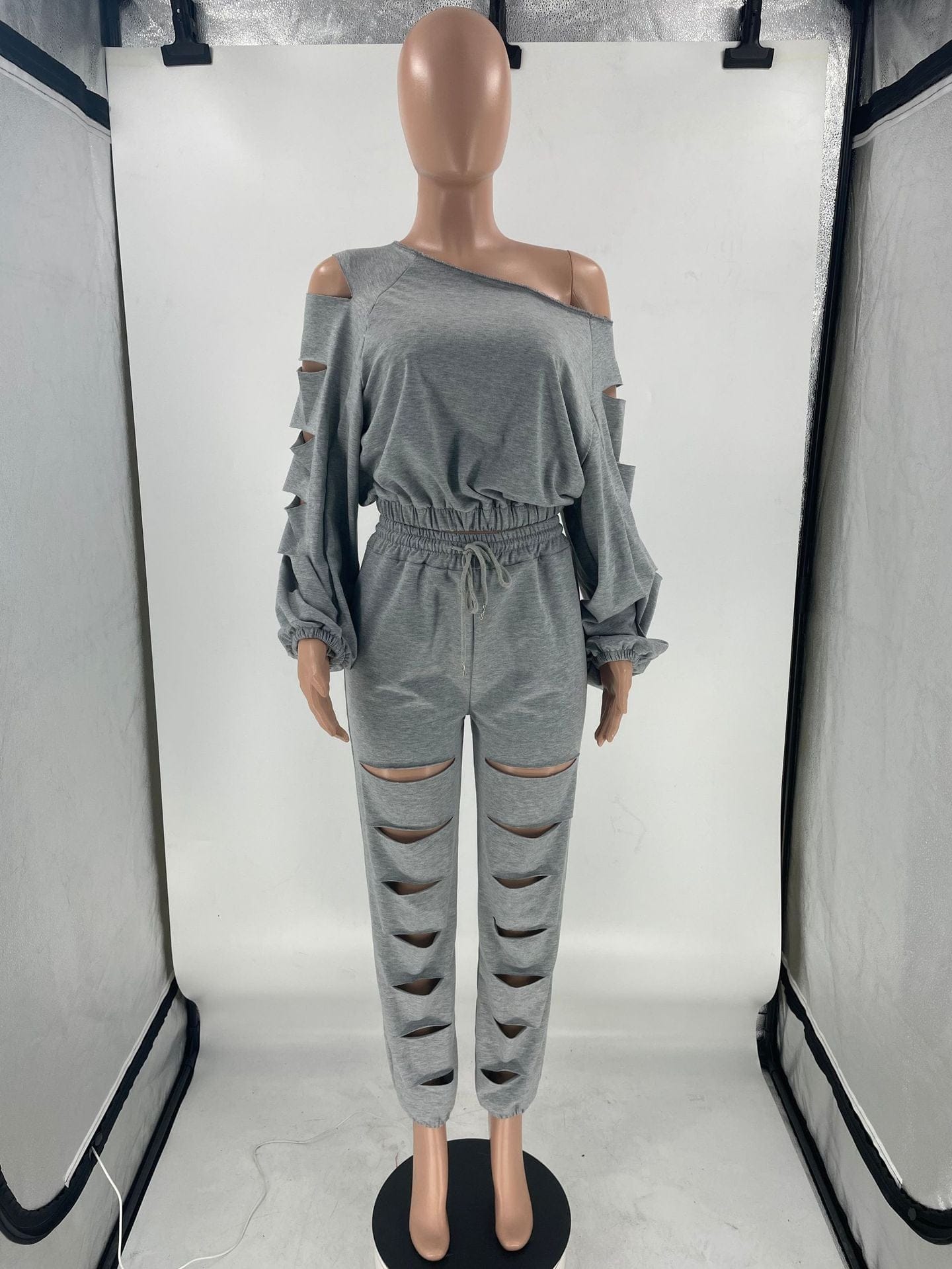 Women's fashion solid color hollow loose casual sloping shoulder sweater two-piece set